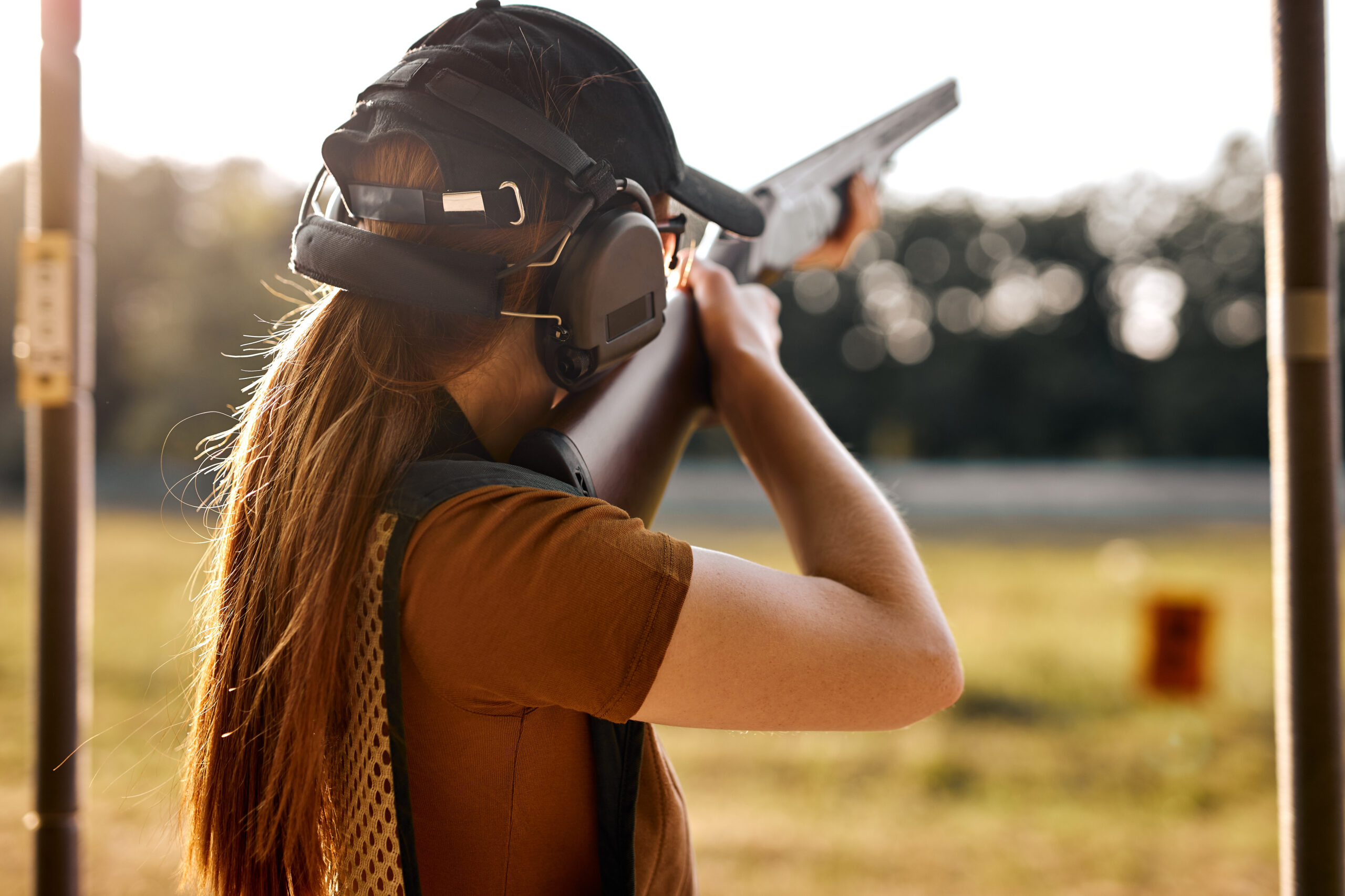 A woman takes aim on the range
