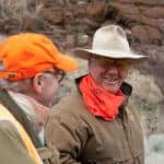 Two men wearing outdoor clothing.