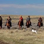 Hunters on horseback